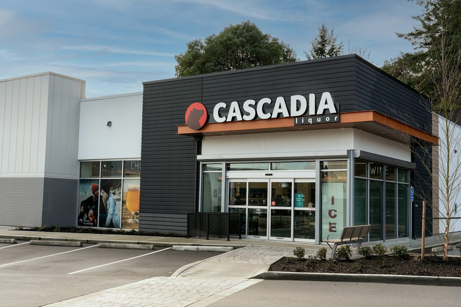 Cascadia Liquor Allandale store front with the sign "Cascadia liquor" prominently displayed, featuring large glass windows and a modern design.