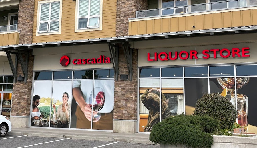 Cascadia Liquor Eagle Creek storefront featuring the words "Cascadia" and "LIQUOR STORE," with images of people and beverages.
